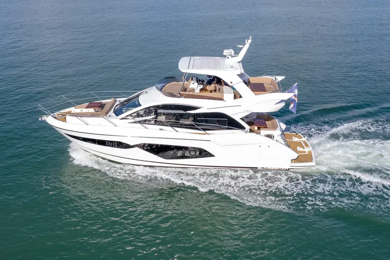 Slide: The Image of 2018 Sunseeker Manhattan 52 yacht cruising on open water. - 7