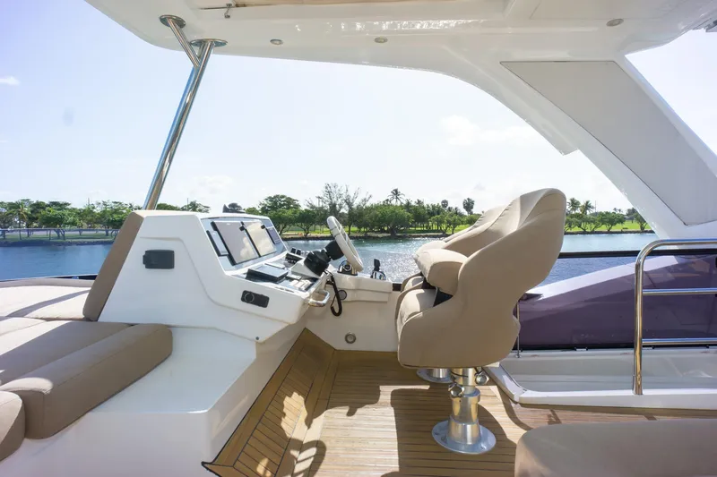 Slide: The Image of Luxurious helm of 2018 Sunseeker Manhattan 52 yacht with scenic water view. - 72