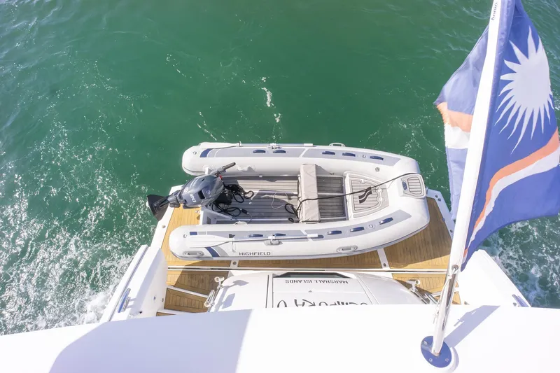 Slide: The Image of 2018 Sunseeker Manhattan 52 yacht with inflatable boat and flag on deck. - 83