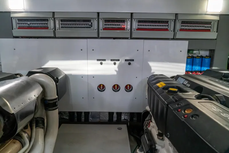 Slide: The Image of Engine room of 2018 Sunseeker Manhattan 52 yacht, showcasing mechanical components and control panels. - 93