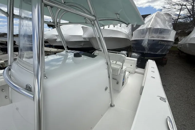 Slide: The Image of 2012 Southport 29 Tournament Edition boat, docked with other covered boats. - 11