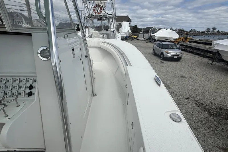 Slide: The Image of 2012 Southport 29 Tournament Edition boat docked, showcasing sleek design and control panel. - 14