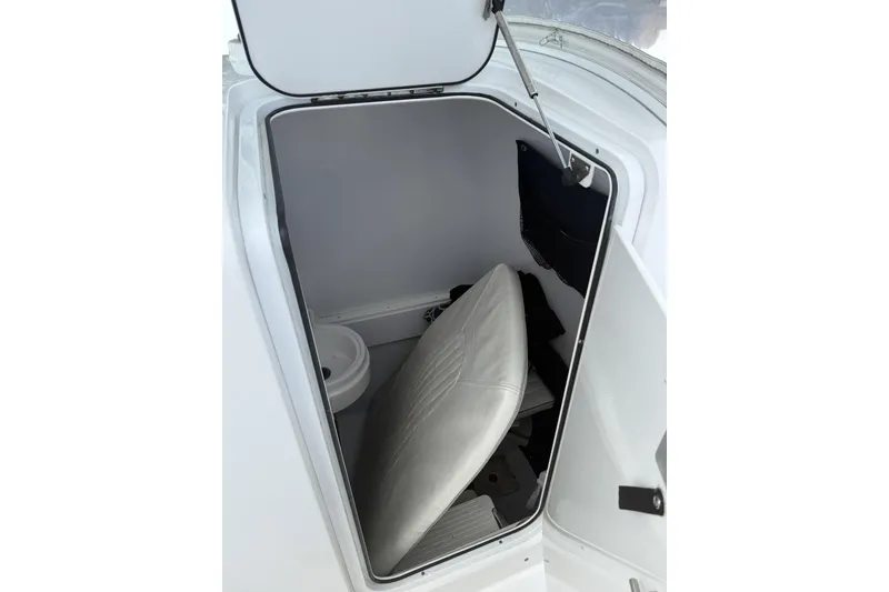 Slide: The Image of 2012 Southport 29 Tournament Edition boat storage compartment with seat and toilet. - 20
