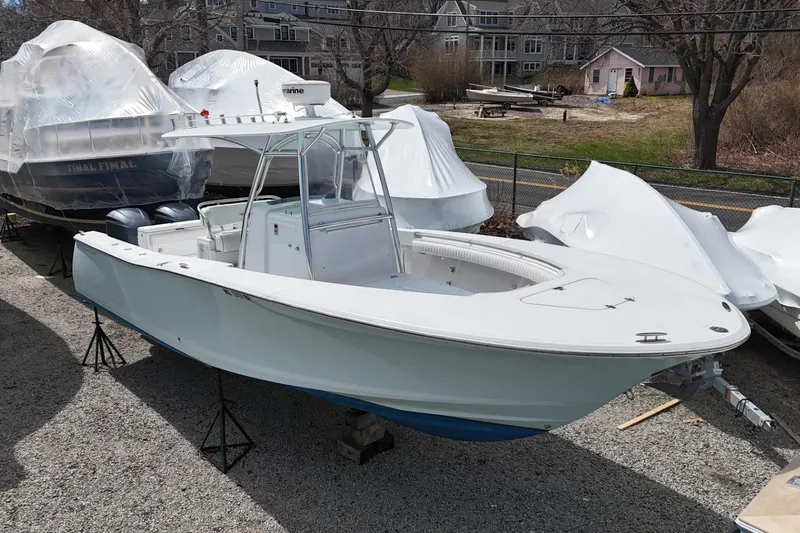 Slide: The Image of 2012 Southport 29 Tournament Edition boat on display, surrounded by covered vessels. - 22