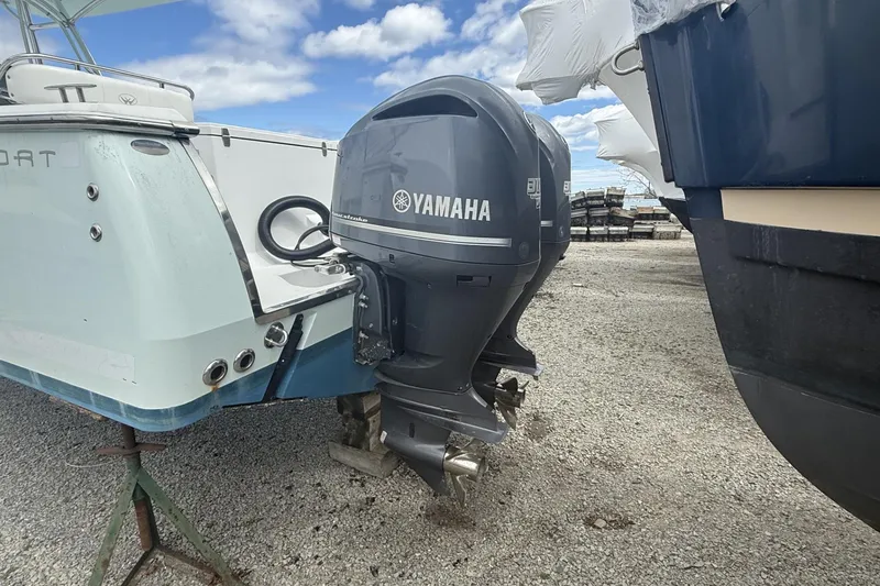 Slide: The Image of 2012 Southport 29 Tournament Edition boat with Yamaha outboard motors on a gravel lot. - 27