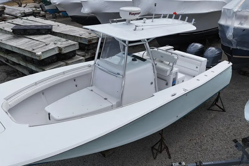 Slide: The Image of 2012 Southport 29 Tournament Edition boat on stands, with dual engines and Raymarine equipment. - 3