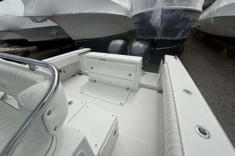 Slide: The Image of 2012 Southport 29 Tournament Edition boat interior with seating and twin engines. - 7