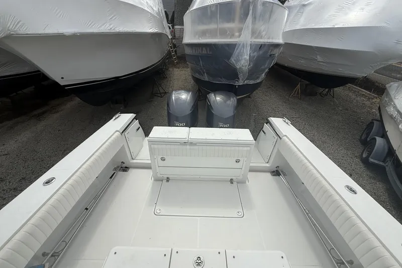 Slide: The Image of 2012 Southport 29 Tournament Edition boat with twin 300 engines, docked among covered boats. - 8