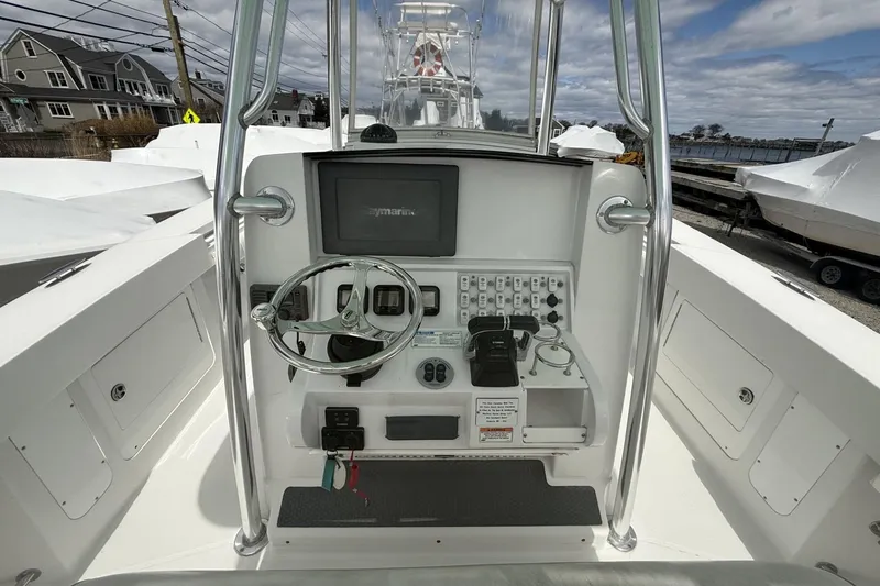 Slide: The Image of 2012 Southport 29 Tournament Edition boat console with steering wheel and navigation equipment. - 16