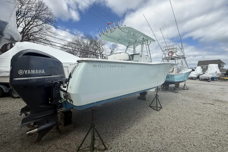 Slide: The Image of 2012 Southport 29 Tournament Edition boat with Yamaha engine on gravel lot. - 21