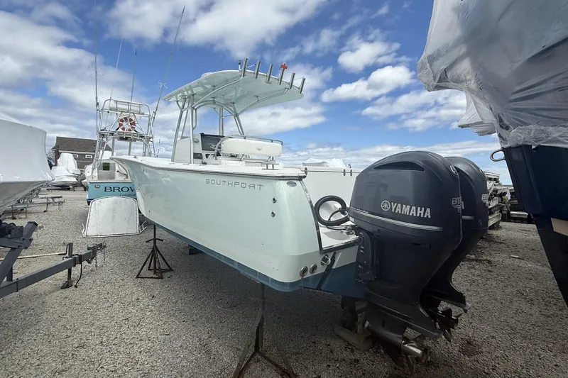 Slide: The Image of 2012 Southport 29 Tournament Edition boat with Yamaha engines on a gravel lot. - 25