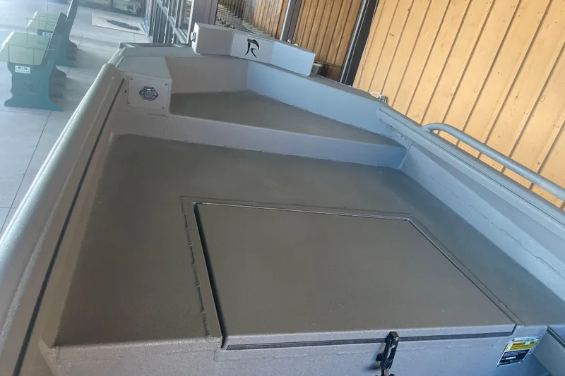 Slide: The Image of 2026 Reaper Boats 550 Timber Reaper, showcasing spacious deck and storage compartment. - 12