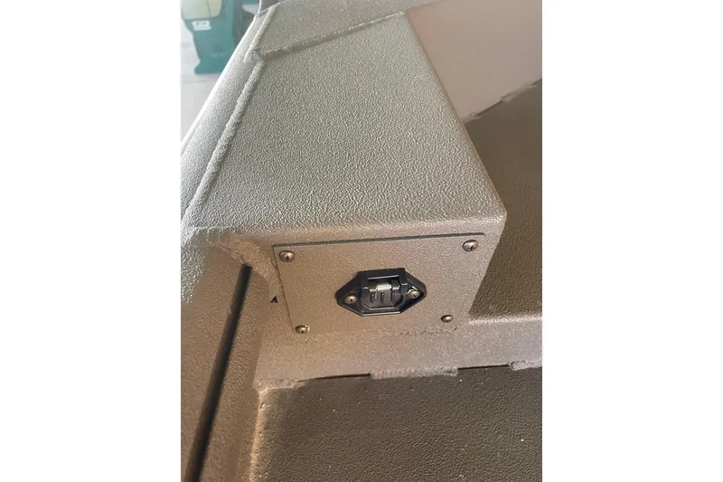 Slide: The Image of 2026 Reaper Boats 550 Timber Reaper interior detail with textured surface and mounted switch. - 13