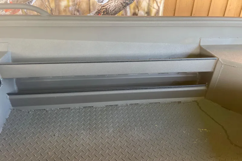 Slide: The Image of Interior view of 2026 Reaper Boats 550 Timber Reaper with textured flooring. - 15