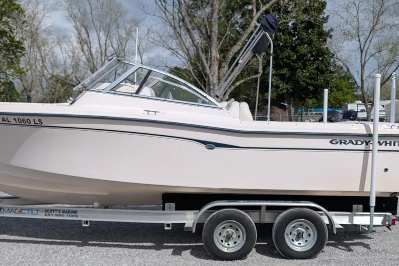 The Image of 2007 Grady-White Tournament 225 boat on trailer, parked outdoors. - 0