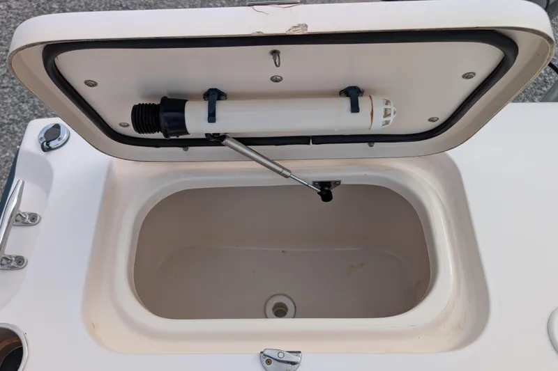 Slide: The Image of Open storage compartment on a 2007 Grady-White Tournament 225 boat. - 10