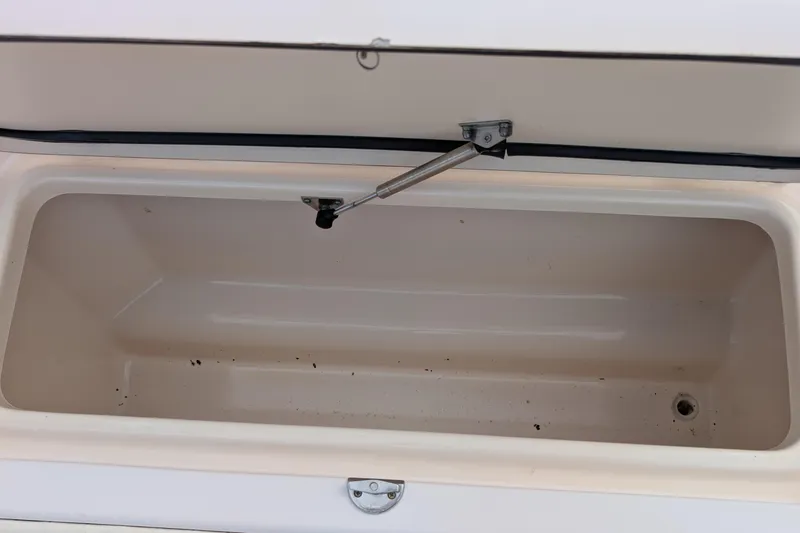 Slide: The Image of Open storage compartment on a 2007 Grady-White Tournament 225 boat. - 11