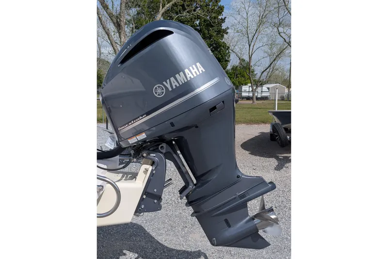 Slide: The Image of Yamaha outboard motor on 2007 Grady-White Tournament 225 boat, parked outdoors. - 4