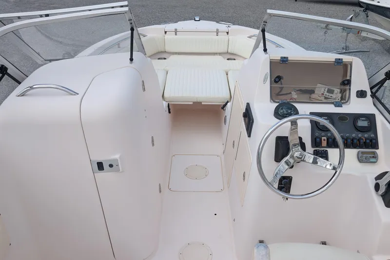Slide: The Image of 2007 Grady-White Tournament 225 boat interior with steering wheel and seating area. - 5
