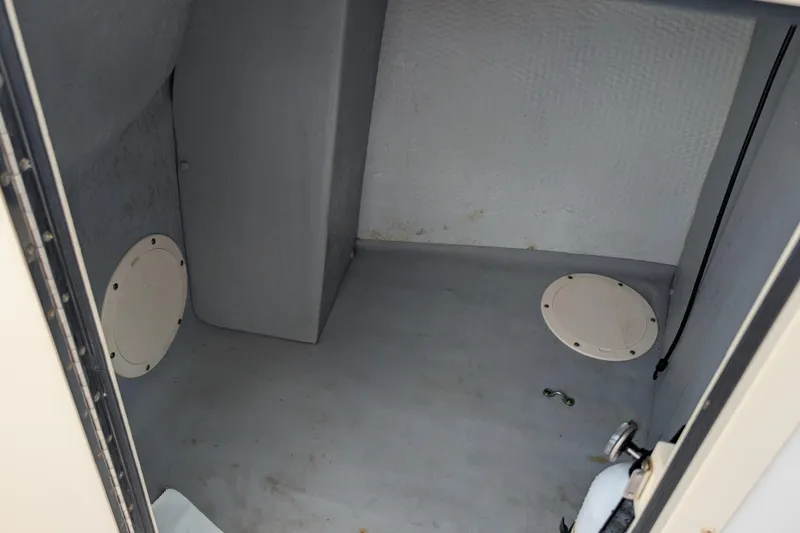 Slide: The Image of Interior storage compartment of a 2007 Grady-White Tournament 225 boat. - 8