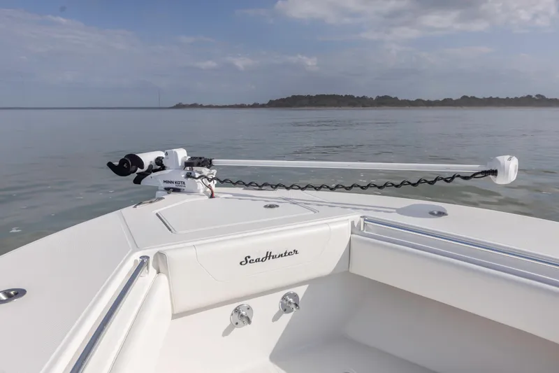Slide: The Image of 2021 SeaHunter 28 Floridian boat with Minn Kota trolling motor on calm water. - 18
