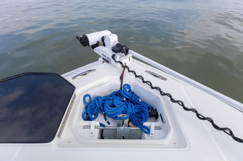 Slide: The Image of Bow of 2021 SeaHunter 28 Floridian with blue rope and trolling motor. - 24