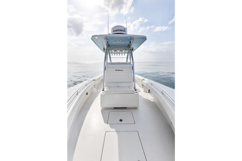 Slide: The Image of 2021 SeaHunter 28 Floridian boat on calm ocean under cloudy sky. - 27