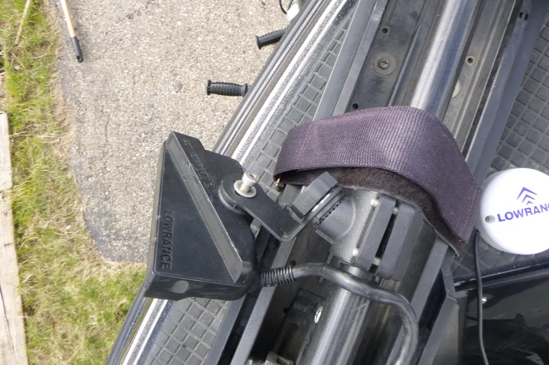 Slide: The Image of Lowrance transducer mounted on 2019 Triton 206 Allure boat, secured with a strap. - 10