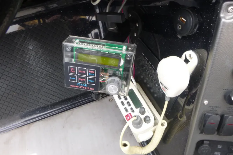 Slide: The Image of Control panel and microphone setup in a 2019 Triton 206 Allure boat. - 19