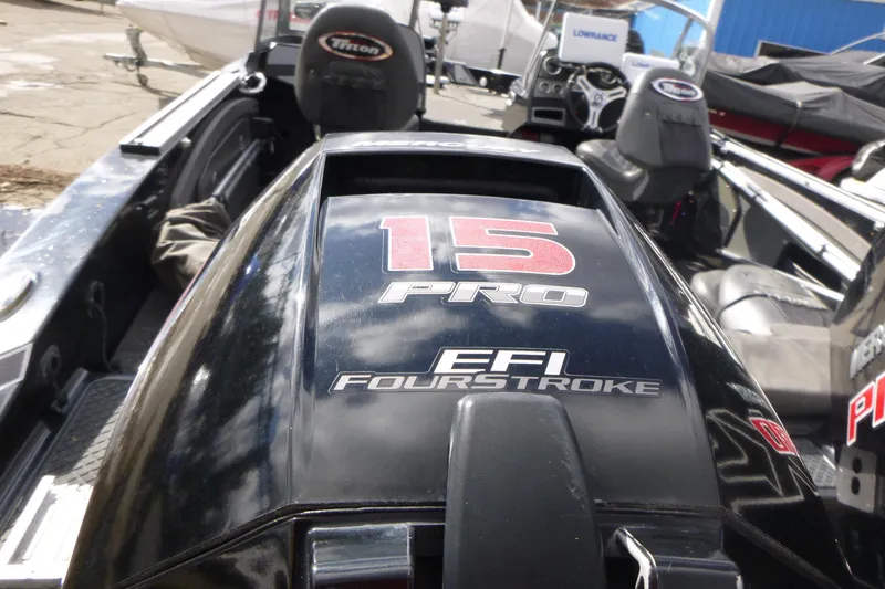 Slide: The Image of 2019 Triton 206 Allure boat with EFI FourStroke engine, featuring "15 Pro" branding. - 24