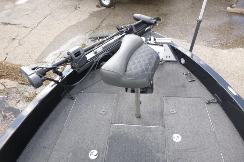 Slide: The Image of 2019 Triton 206 Allure boat deck with seat and trolling motor. - 7