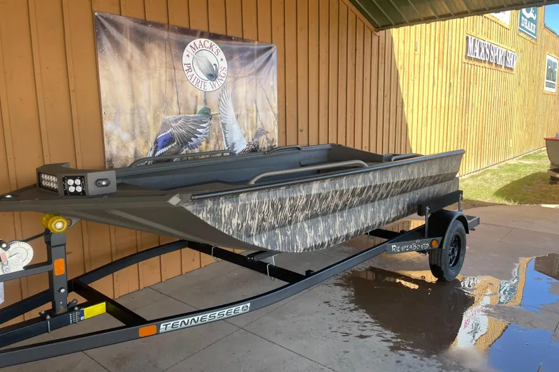 Slide: The Image of 2026 Reaper Boats 553 Timber Reaper on trailer, displayed outdoors at Mack's Prairie Wings. - 3