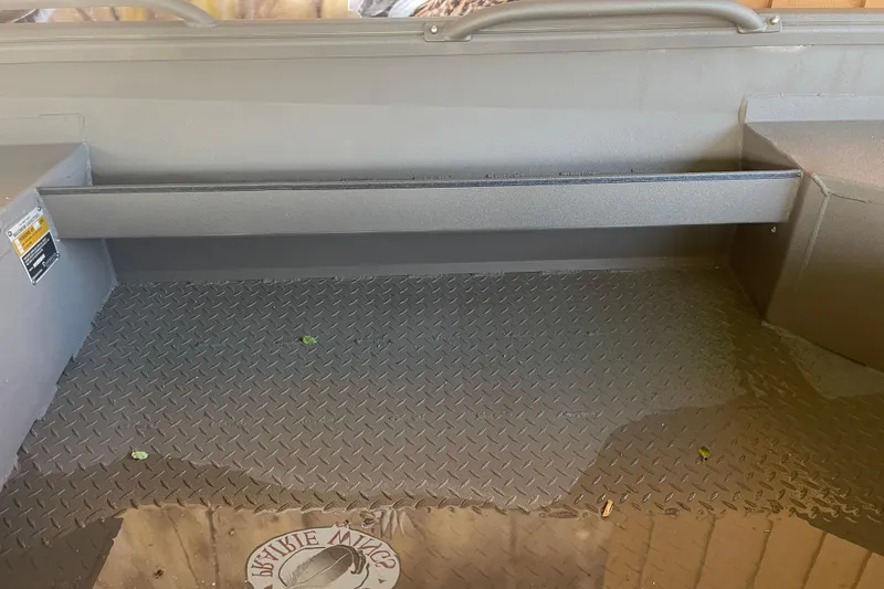 Slide: The Image of Interior view of 2026 Reaper Boats 553 Timber Reaper with diamond plate flooring. - 4