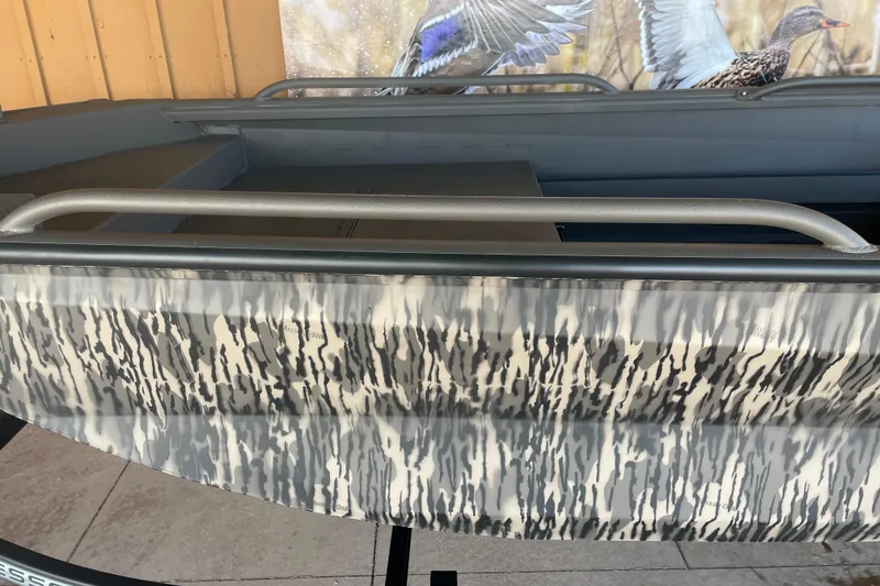 Slide: The Image of 2026 Reaper Boats 553 Timber Reaper with camouflage pattern and sturdy railings. - 9