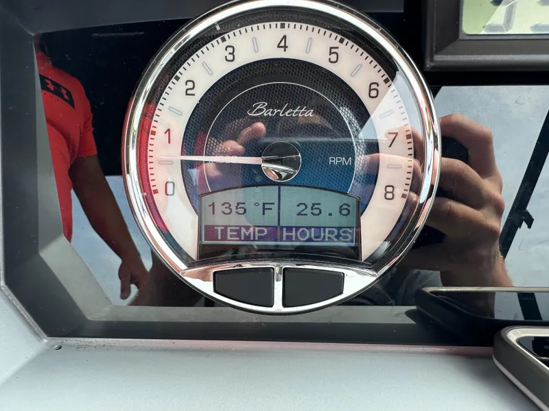 Slide: The Image of 2023 Barletta Corsa 23UC dashboard gauge showing 135°F temperature and 25.6 hours. - 20