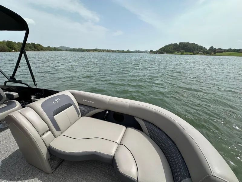 Slide: The Image of 2023 Barletta Corsa 23UC pontoon boat interior with scenic lake view. - 22