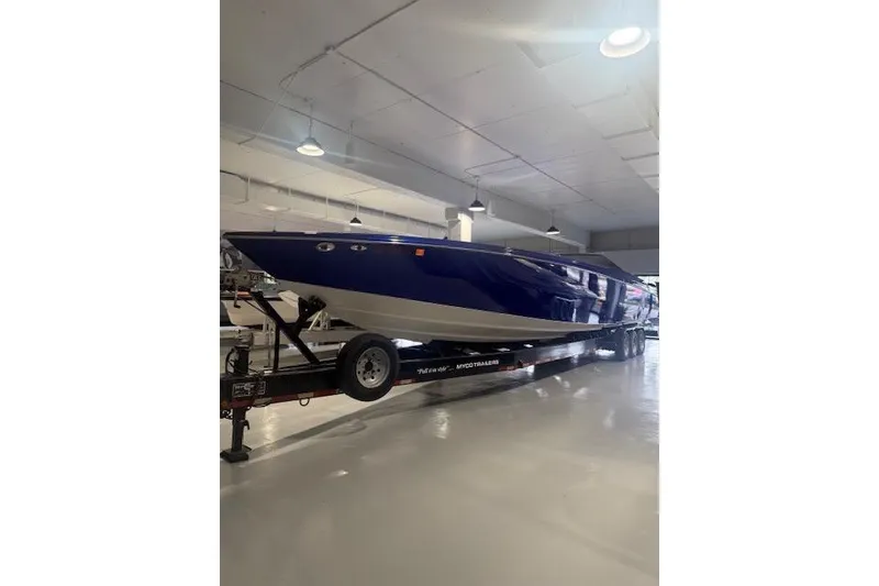 Slide: The Image of 2007 Nor-Tech 5000V boat in a showroom, displayed on a trailer. - 4