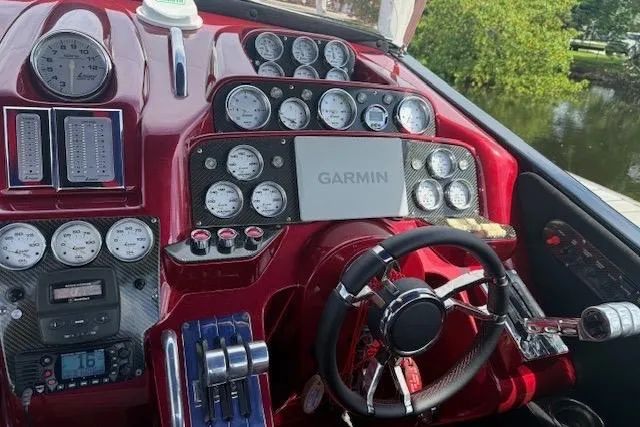 Slide: The Image of Dashboard of a 2007 Nor-Tech 5000V boat with Garmin navigation system. - 7