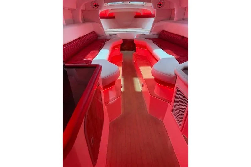 Slide: The Image of Luxurious interior of a 2007 Nor-Tech 5000V boat with red ambient lighting. - 8