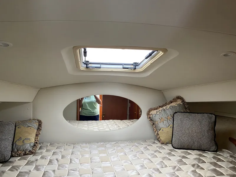 Slide: The Image of Interior of a 2002 Silverton 330 yacht with bed and skylight. - 13