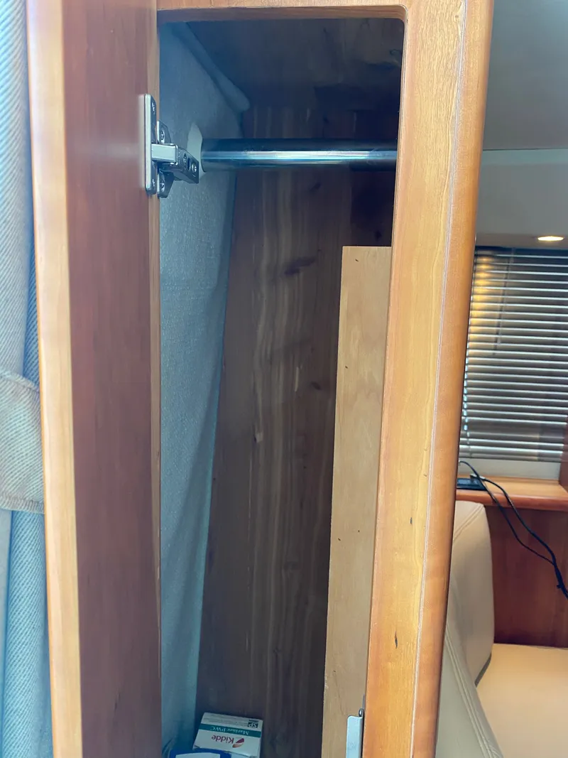 Slide: The Image of Interior of a 2002 Silverton 330 with wooden cabinet. - 29