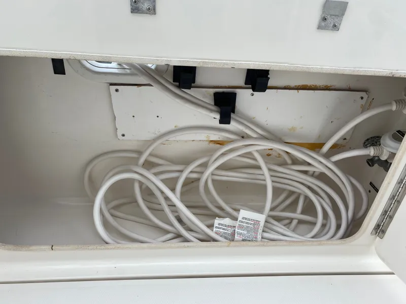 Slide: The Image of Storage compartment in Silverton 330 boat with cables, year 2002. - 41