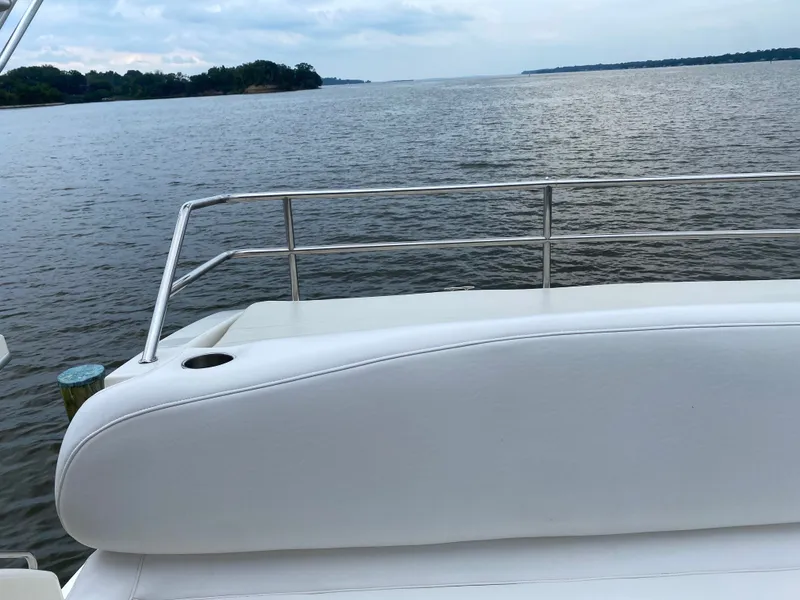 Slide: The Image of Rear view of Silverton 330 yacht on calm waters. - 43