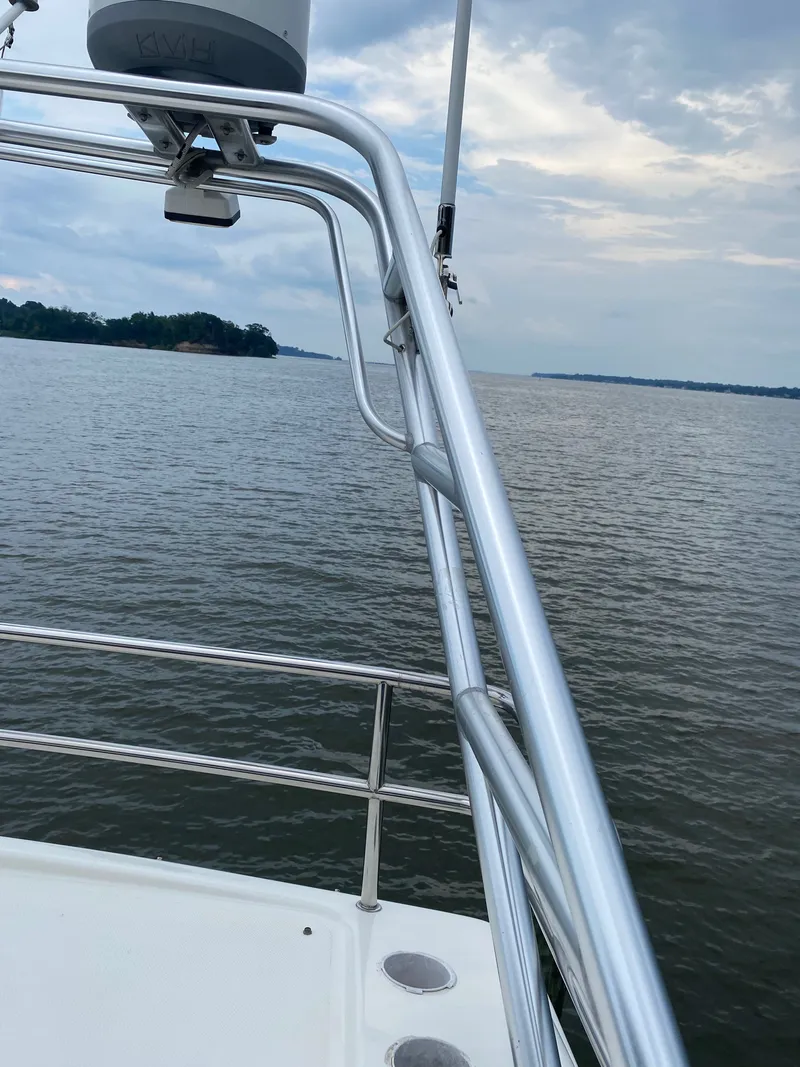 Slide: The Image of View from a 2002 Silverton 330 yacht overlooking calm waters. - 45