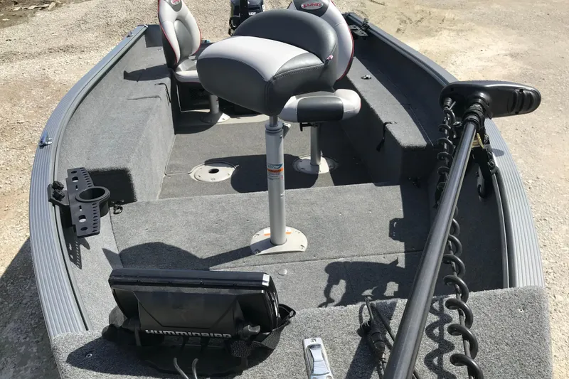 Slide: The Image of 2007 Lund 1425 Classic Tiller boat interior with seating and fishing equipment. - 6