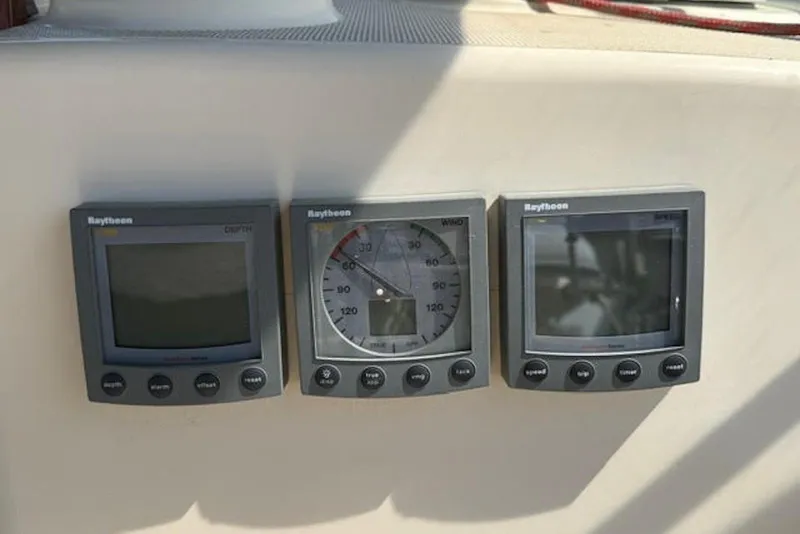 Slide: The Image of Raytheon marine instruments on 2001 Island Packet 380 sailboat dashboard. - 19