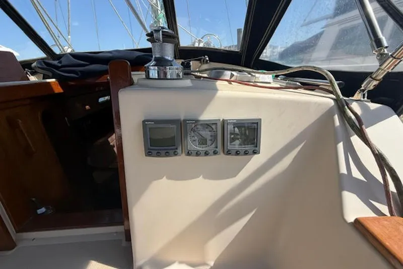 Slide: The Image of Cockpit instruments on a 2001 Island Packet 380 sailboat under clear skies. - 20