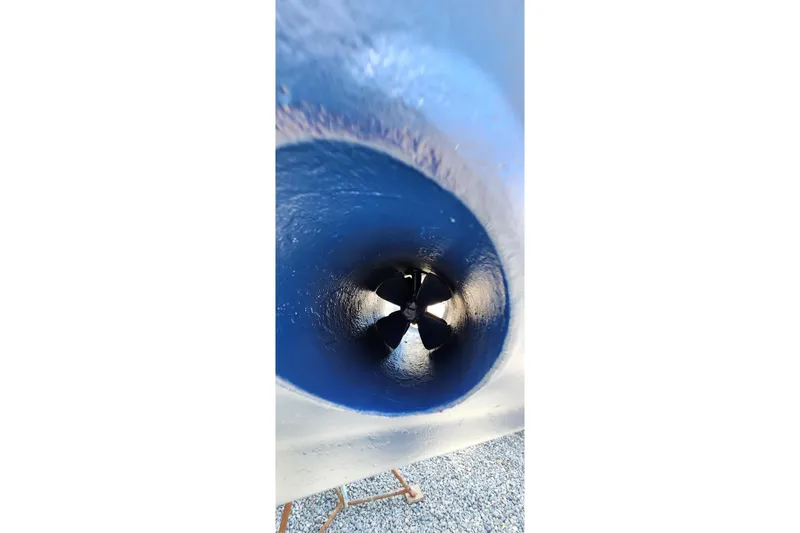Slide: The Image of Bow thruster of a 2001 Island Packet 380 sailboat, painted in blue. - 23