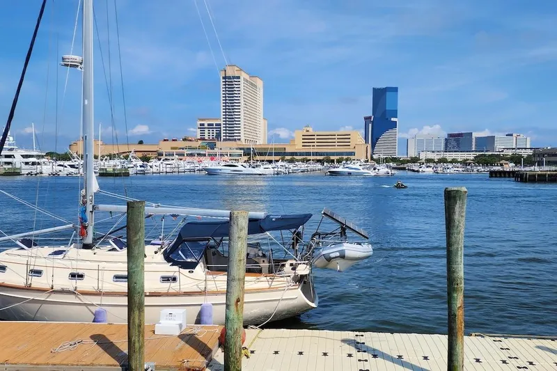 Slide: The Image of Island Packet 380 sailboat docked in marina with city skyline, 2001 model. - 4