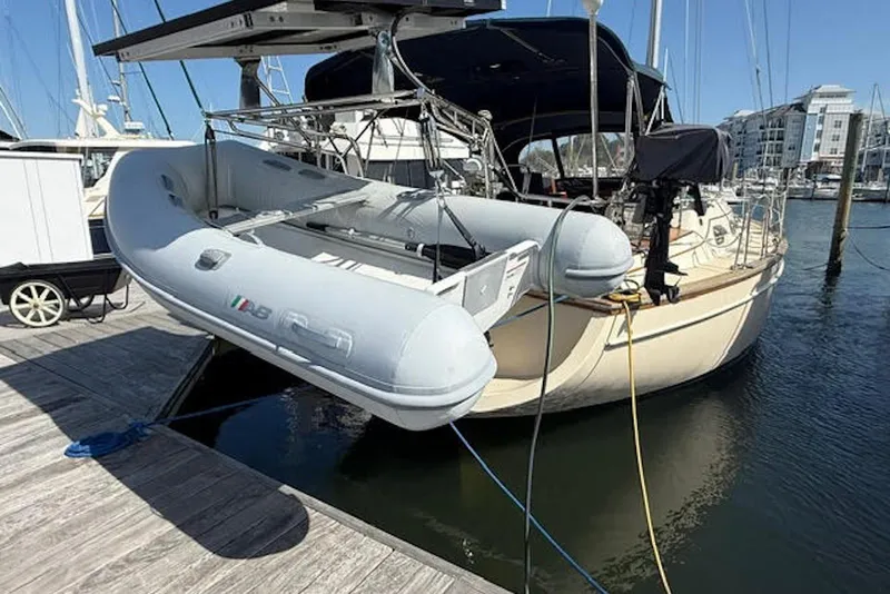 Slide: The Image of Island Packet 380 sailboat from 2001 docked with inflatable dinghy attached. - 46